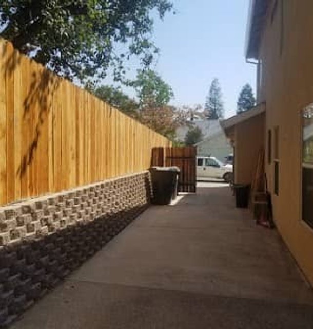 Narrow side yard pathway with timber fence and gravel border