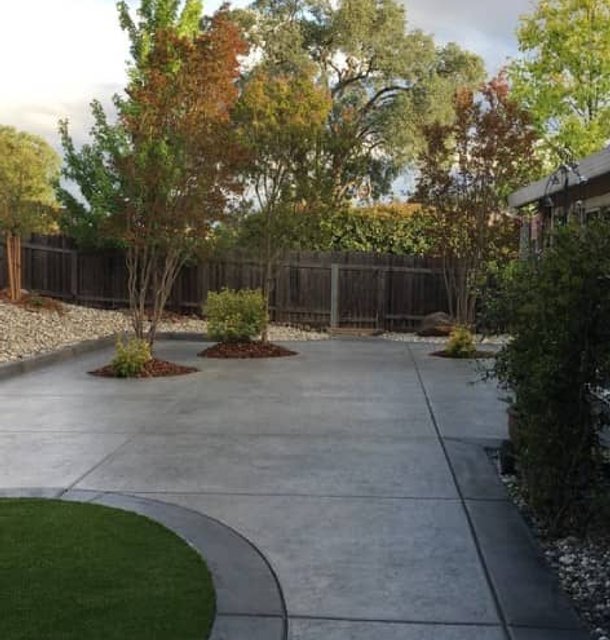 Front yard walkway with gravel edging and mulch beds