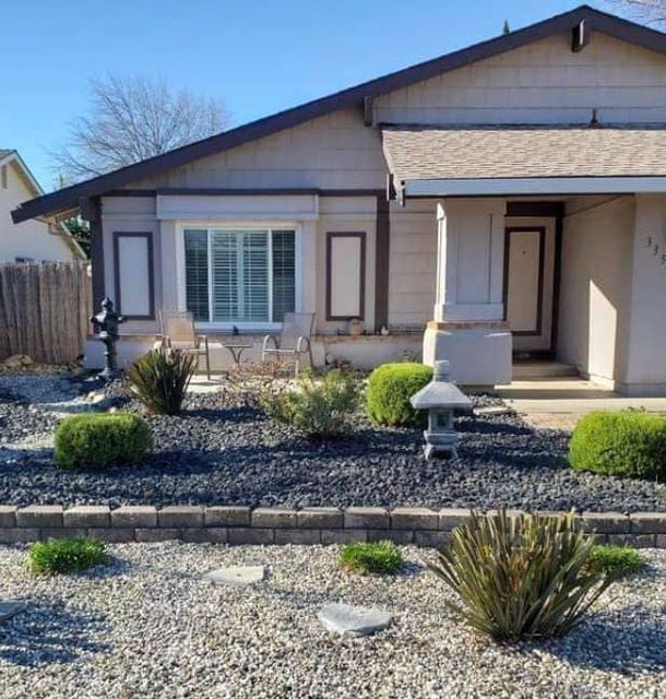 Modern single-story home with drought-tolerant front landscaping