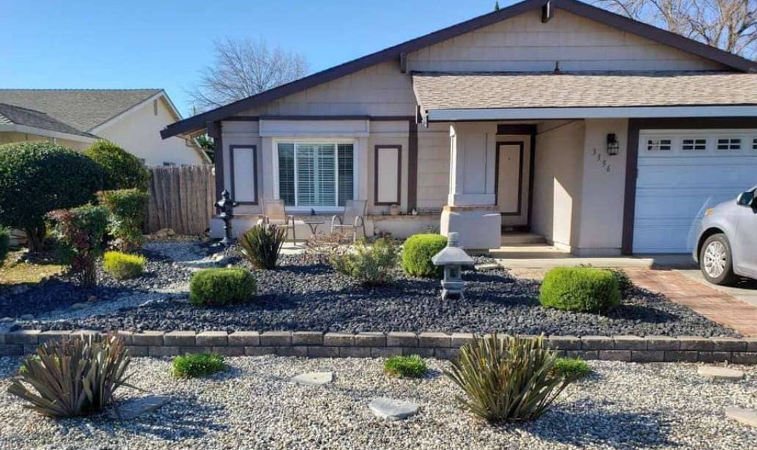 Modern single-story home with drought-tolerant front landscaping