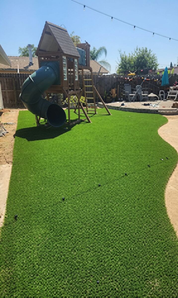 Artificial turf backyard with play structure in Elk Grove area