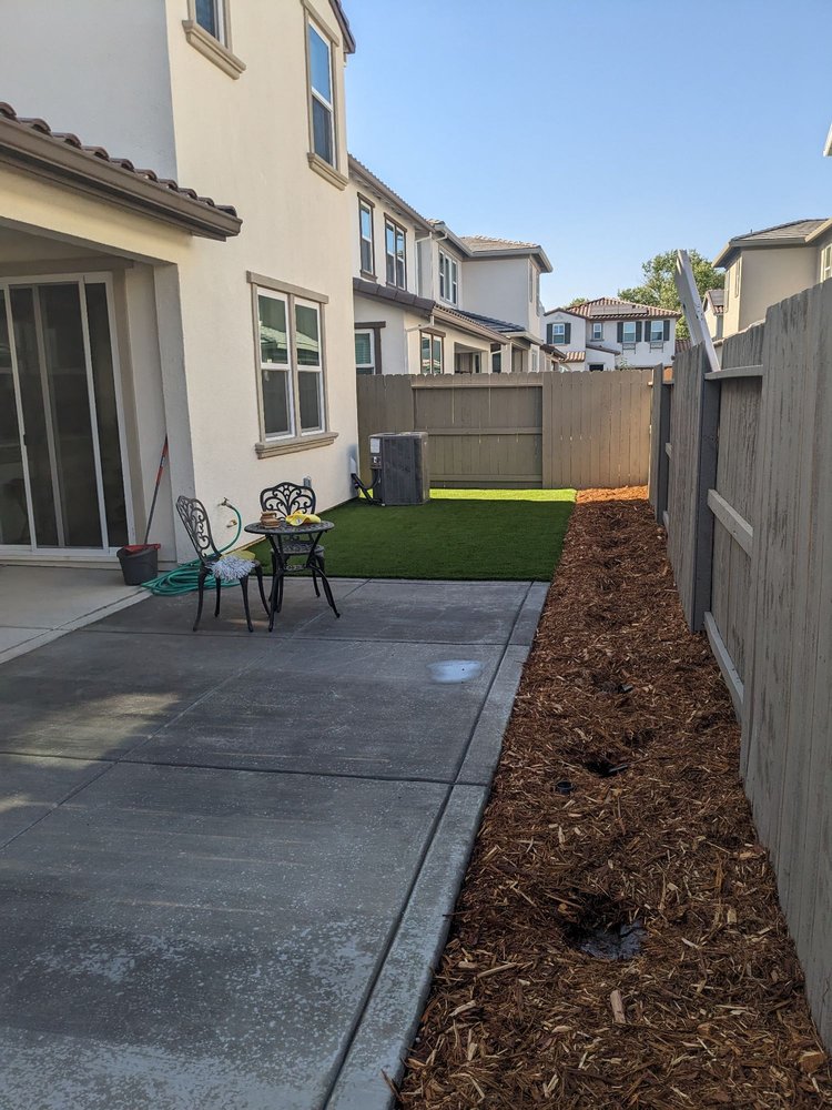 Backyard turf and concrete patio installation Sacramento