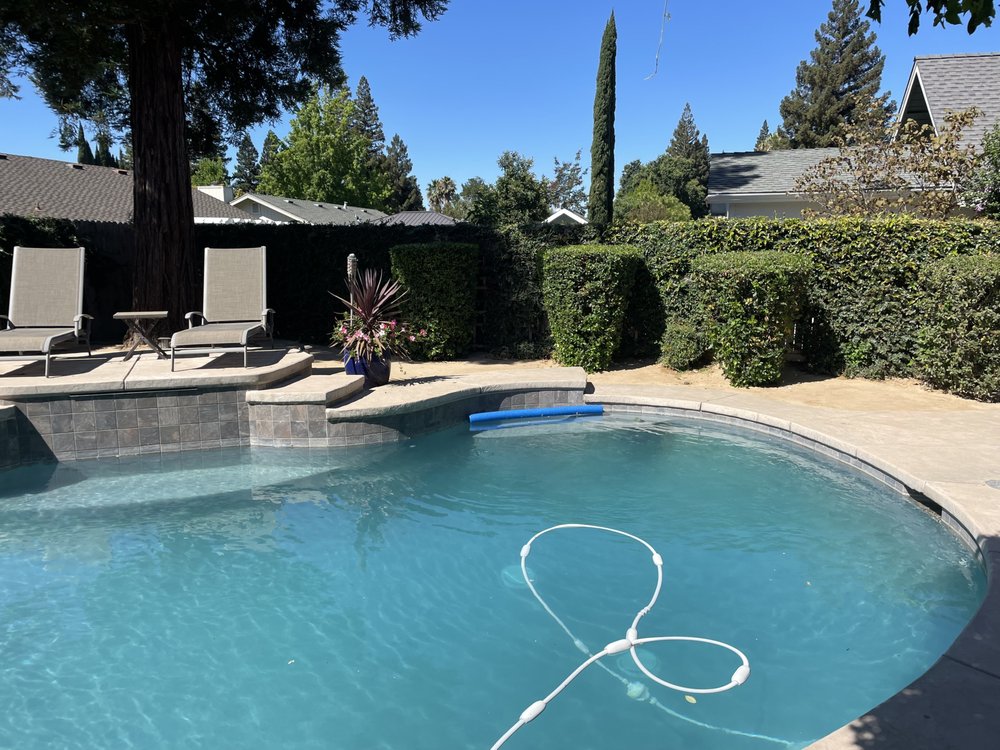 Decorative rock landscaping with concrete border