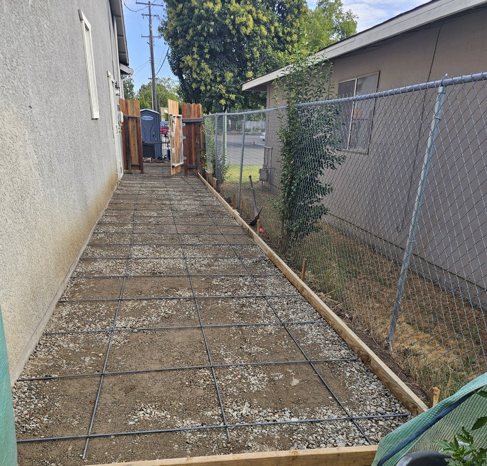 Featured backyard renovation project in Elk Grove with retaining walls and artificial turf by Green Landscaping of Sacramento